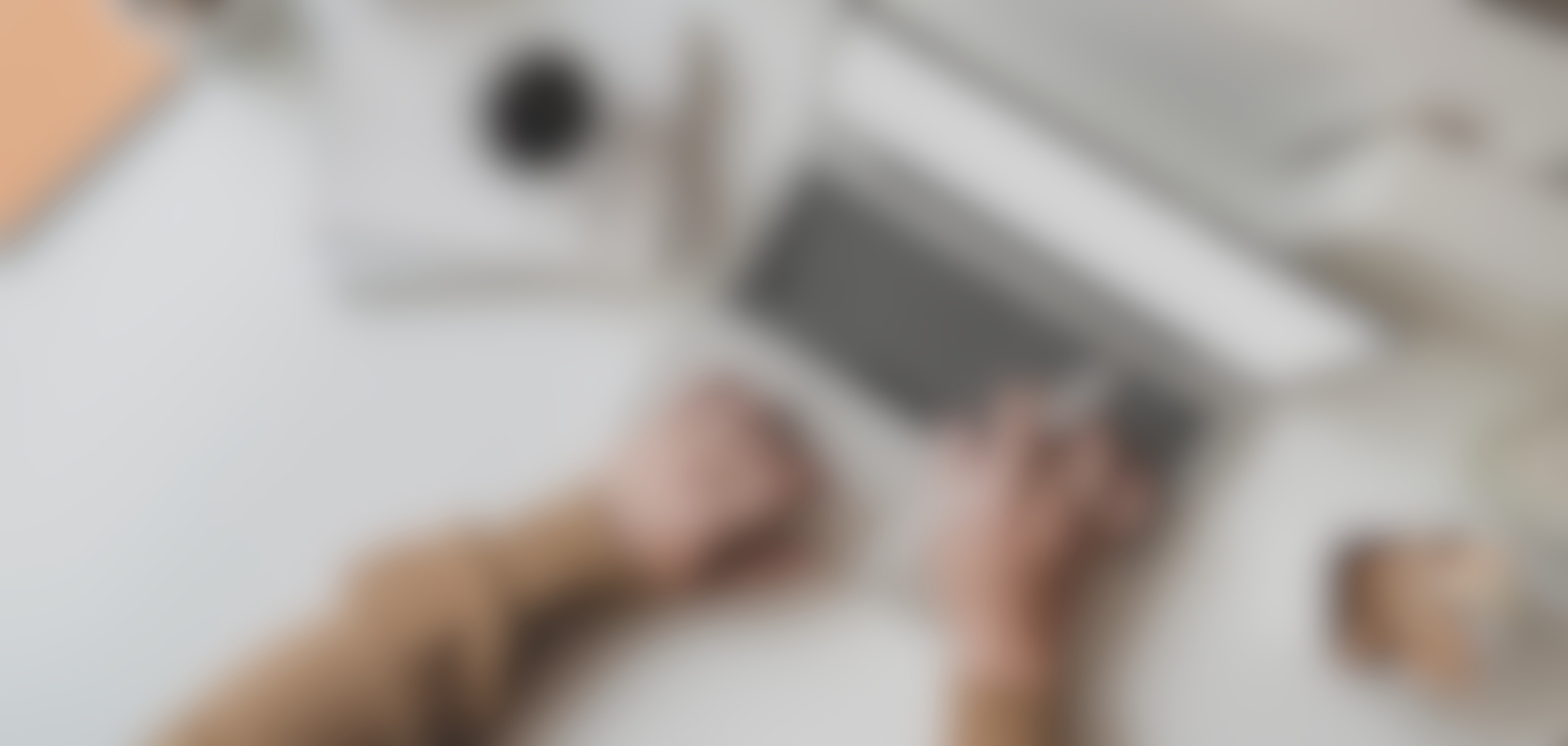 Working Man Is Typing on Black Frame Laptop